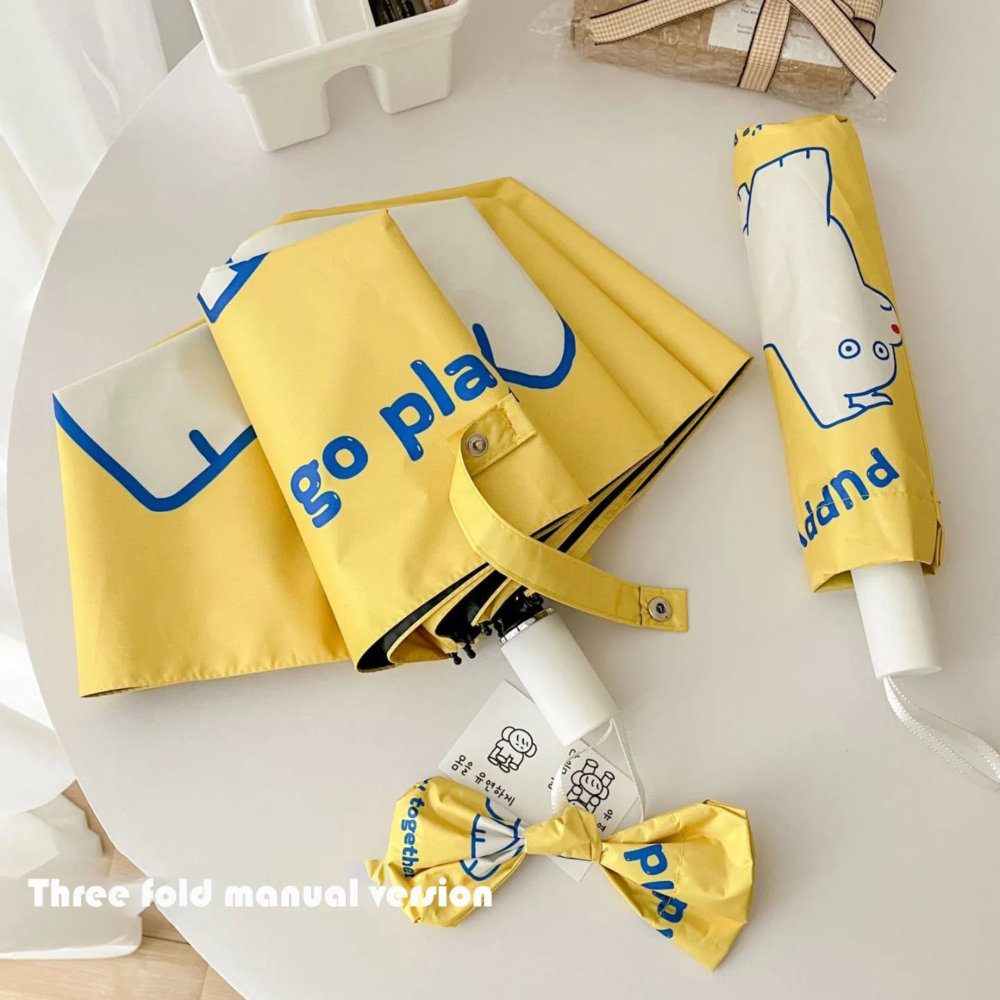 An outdoor travel umbrella with dog prints, a 50% discount mini sun umbrella, sun protection and UV protection,